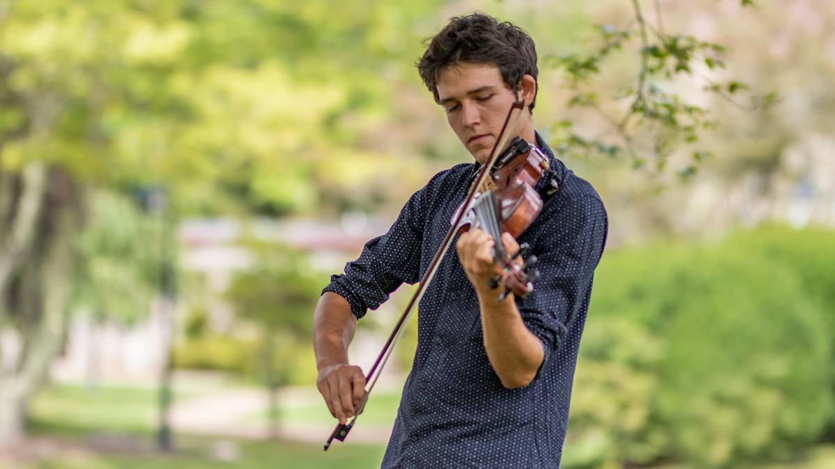 student playing the fiddle