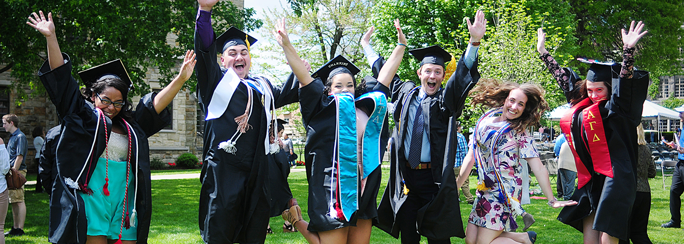 Grads jumping in the air